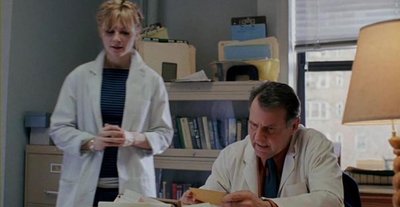 Mary (Dunst) and Dr. Mierzwiak (Wilkinson) in the Lacuna offices.