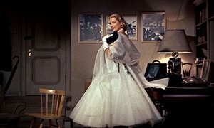 Grace Kelly poses in a evening gown.